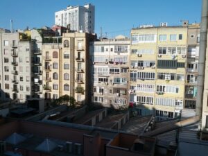 Apartment balcony overlooking a city view, similar to Downtown Collection homes