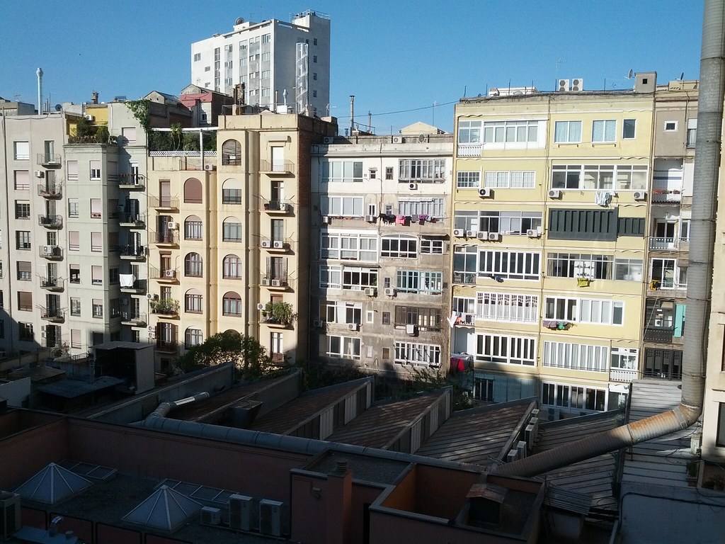 Apartment balcony overlooking a city view, similar to Downtown Collection homes