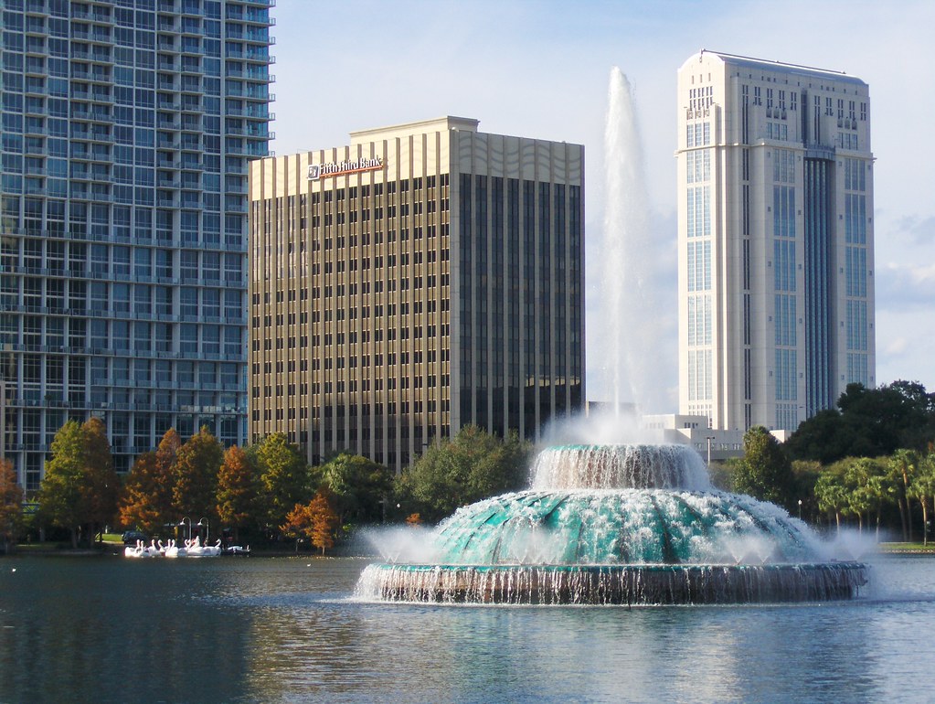 Fountain at Lake Eola Park in downtown Orlando with the city skyline behind it