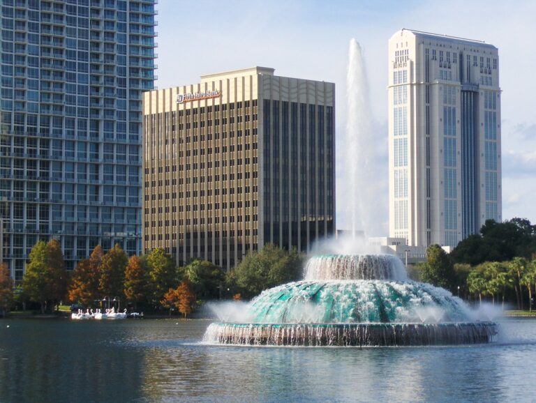 Fountain at Lake Eola Park in downtown Orlando with the city skyline behind it